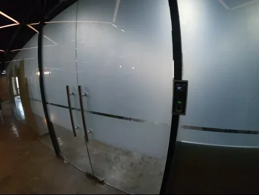 Biometric access reader on the glass entry doors at OutForce's Ortigas office