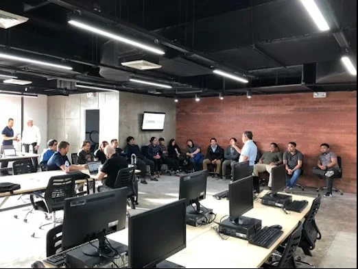 Team briefing in the training area of OutForce's Ortigas office